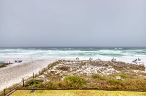 The condominiums are adjacent to the beach.