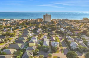 The gated Emerald Shores community is a short stroll or tram ride from the beautiful Miramar Beach shoreline.