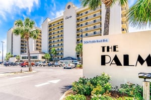 View from the street of the Palms and the entry sign in Orange Beach Alabama