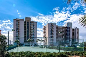 The outdoor tennis courts in front of Phoenix II in Orange Beach Alabama