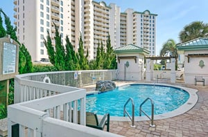 A community pool with a waterfall