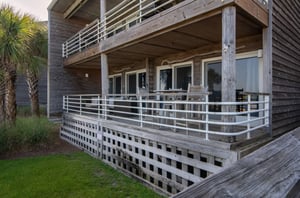 View of the exterior of a private balcony with chairs at Needle Rush Point