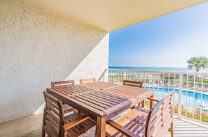 A dining table on private balcony at Seaside Beach and Racquet Club in Orange Beach Alabama