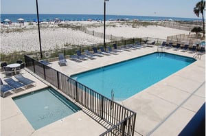 Stay relaxed at the pool and hot tub at Island Winds West in Gulf Shores AL