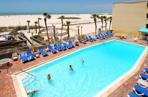 Guests swimming in one of two outdoor swimming pools at Bilmar Beach Resort in St. Pete Beach Florida