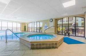 The indoor hot tub next to the swimming pool at Harbour Place in Orange Beach Alabama