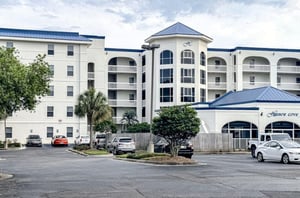 View from the parking lot of the entrance to Harbor Cove in Orange Beach Alabama