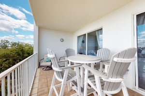 A private table with a table and chairs at Harbor Cove in Orange Beach Alabama