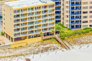 Birds eye view of Emerald Skye next to the beach in Orange Beach Alabama