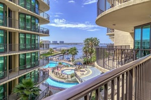 View of the pool area from a private balcony at Phoenix on the Bay in Orange Beach Alabama