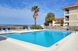 Lounge by the outdoor pool at Sunset Harbor Palms