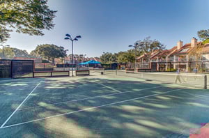 Tennis courts with lighting ready for daytime and nighttime play.