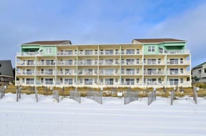 Cabana Club balconies overlook the sugarwhite beach.