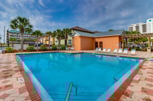 Community swimming pool and sundeck with restrooms