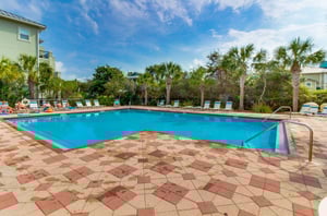 Guests sun by the community pool