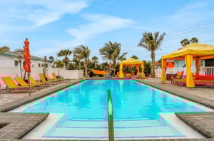 The complex features a refreshing aqua pool surrounded by a spacious sundeck.