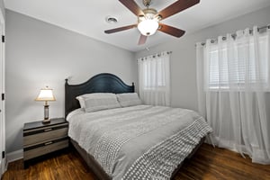 Bedroom with White comforter and bedside table at Buckhorn Springs