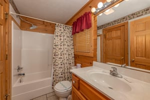 Bathroom with tub and shower at Cubs Crossing, a 3 bedroom cabin rental located in Gatlinburg