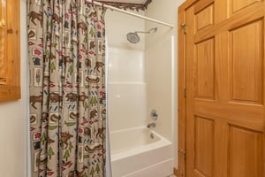 Bathroom with a tub and shower at Cubs Crossing, a 3 bedroom cabin rental located in Gatlinburg