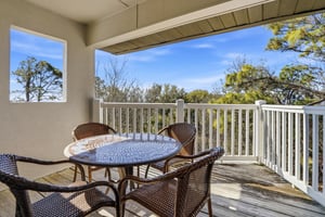 Located on the top floor, this balcony offers a peaceful spot to enjoy morning coffee with soft coastal light and treetop views.