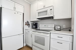 The kitchen features fullsize appliances and a clean, functional layout, perfect for easy meals during your stay.