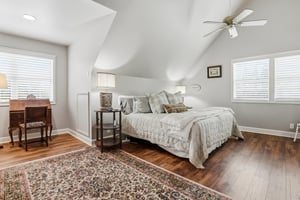 Primary Bedroom With Desk and Vaulted Ceiling