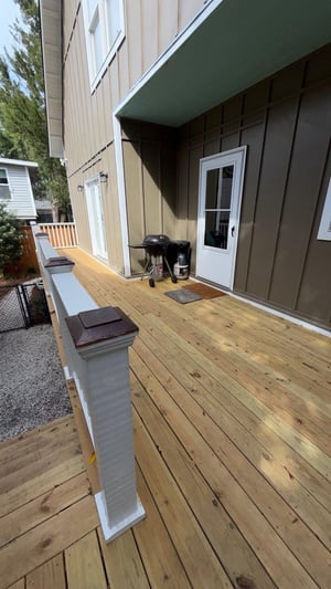 Covered back porch area for a quiet step outside from the main living level.