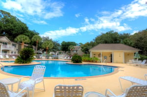 Community pool near Ocean Walk J11 with lounge seating and easy access from the condo.