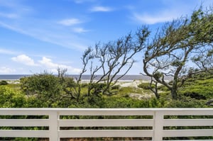Dunes, maritime trees and the Atlantic fill the view from one of the upstairs queen bedrooms.