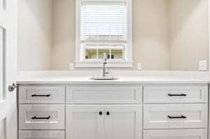 A separate prep area adds useful storage, a second sink and room to keep the main kitchen clear.