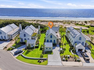 An aerial view of Jekyll Coastline Cottage and its oceanfront setting.