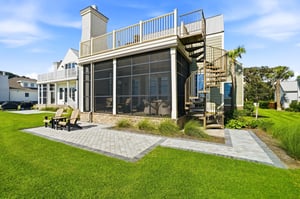 Three outdoor settings face the coast, linked by an exterior spiral stair.