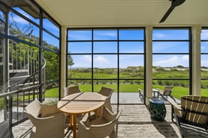 Choose the round dining table or Adirondack chairs overlooking the coast.