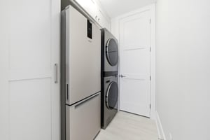 Keep extra drinks and groceries in the fullsize refrigerator beside the laundry.