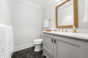 A separate half bath supplements the homes four full bathrooms.