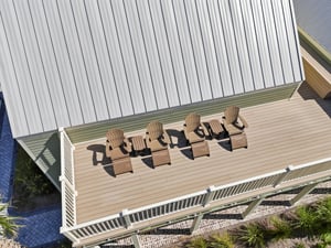 Four loungers and two small tables line this side of the deck.