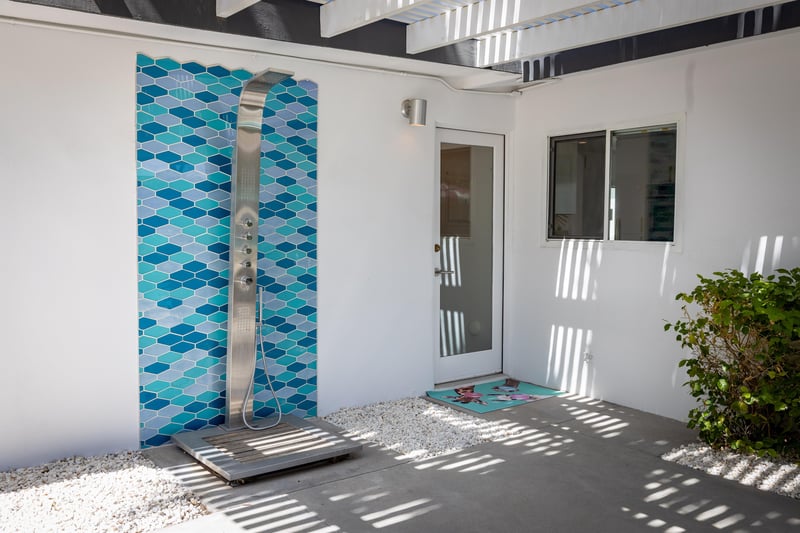 Outdoor Shower With Blue Tile Backsplash