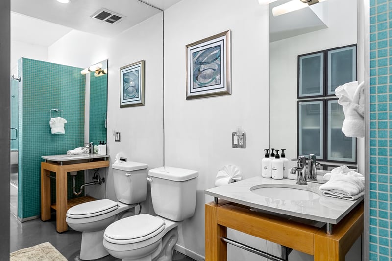 Guest bathroom with wall to wall mirror