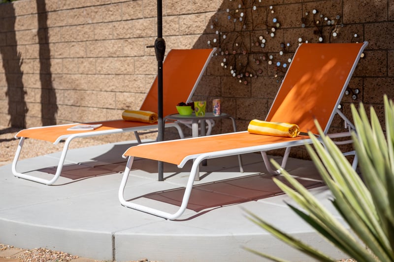 Orange reclining pool chairs
