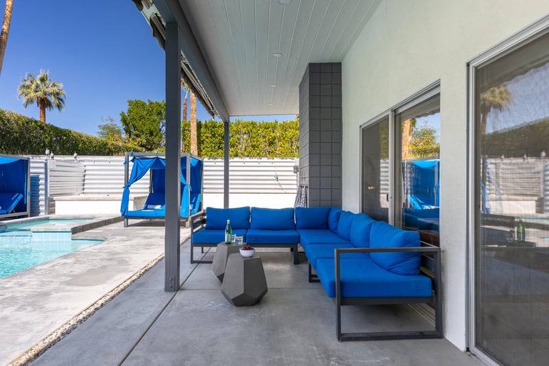 Lovely blue couch with lots of room for everyone to relax
