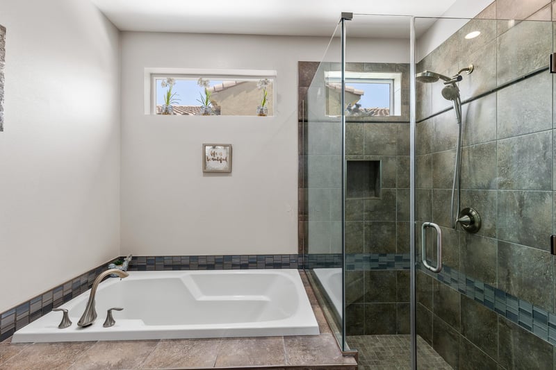 Enjoy a bath or a shower in the primary suite bathroom