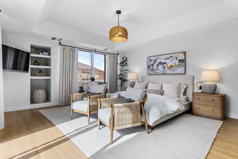 Primary bedroom with cozy chairs
