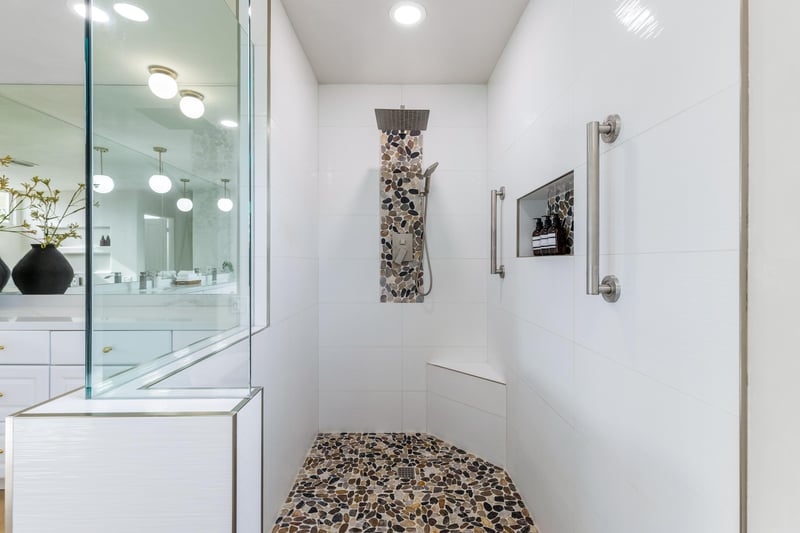 Pebble stone tiled Primary Shower