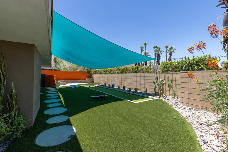 Side yard with bocce ball court