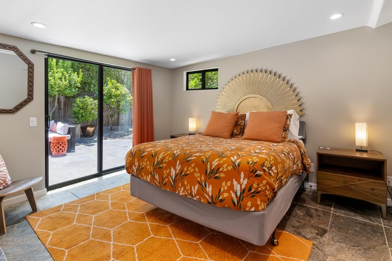 Elegant orange furnishings decorate this guest bedroom