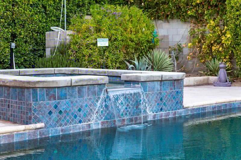 Sparkling pool with waterfall spa