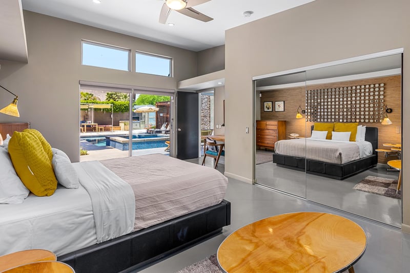 Guest bedroom with beautiful backyard views through sliding doors