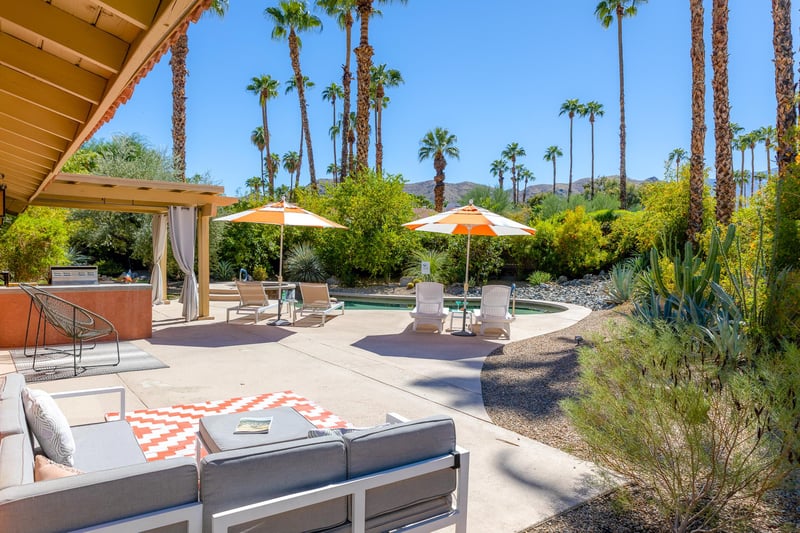 Multiple sitting areas in this beautiful back yard