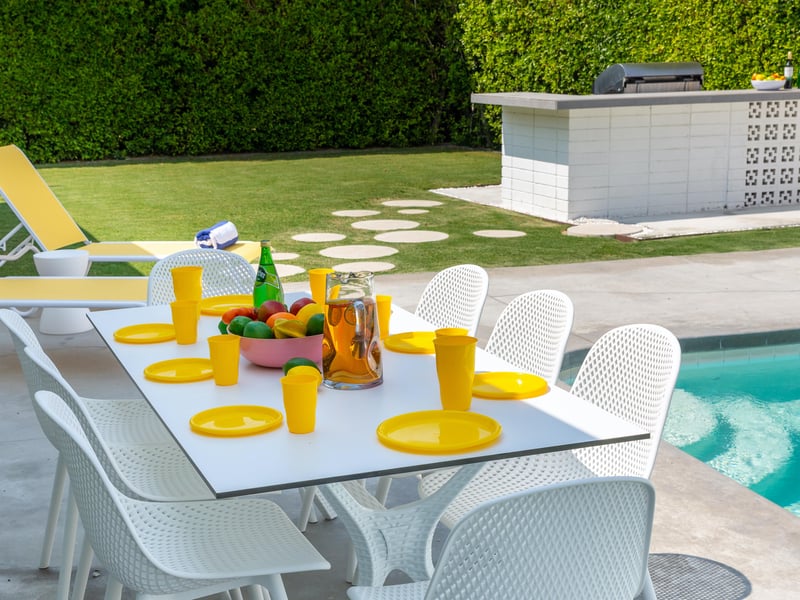 Alfresco dining by the pool for up to 8 guests