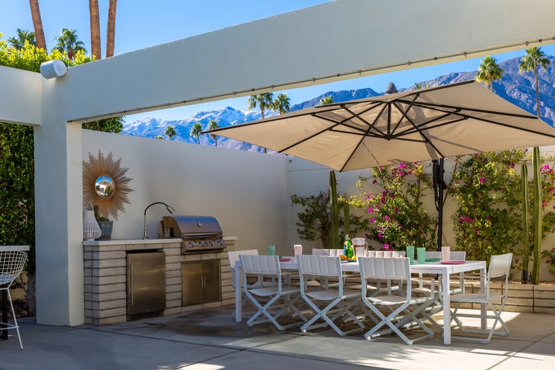 Outdoor cooking station with builtin BBQ grill